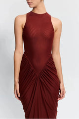 Othelia Gown Rust by Effie Kats, a sheer mesh gown with signature neckline and earthy tone. Perfect for autumn weddings or dinners.