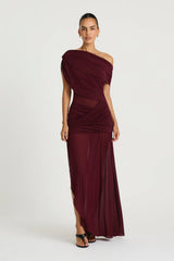 Otto Maxi Dress in Plum by Benni, a one-shoulder stretch mesh maxi with draped detailing, twisted skirt, and front split.