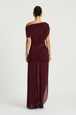 Otto Maxi Dress in Plum by Benni, a one-shoulder stretch mesh maxi with draped detailing, twisted skirt, and front split.