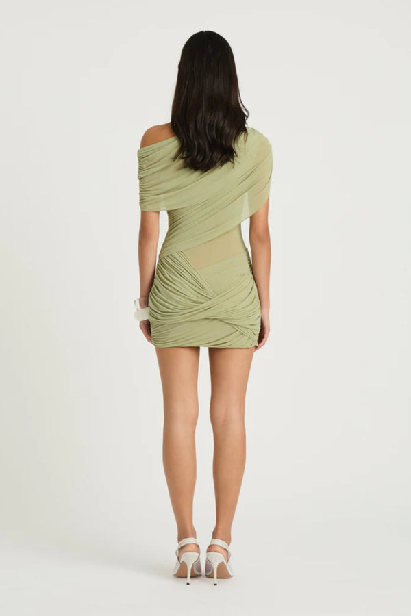 Otto Mini Dress Pistachio by Benni, asymmetric one-shoulder mini with sheer bodice and twisted draped skirt, a bold trendy look for nights out.