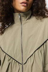 Overturn Jacket Fern by Mossman - lightweight technical jacket with funnel neckline and voluminous sleeves, perfect for modern elevated layering.