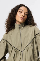 Overturn Jacket Fern by Mossman - lightweight technical jacket with funnel neckline and voluminous sleeves, perfect for modern elevated layering.