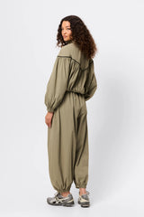 Overturn Jacket Fern by Mossman - lightweight technical jacket with funnel neckline and voluminous sleeves, perfect for modern elevated layering.