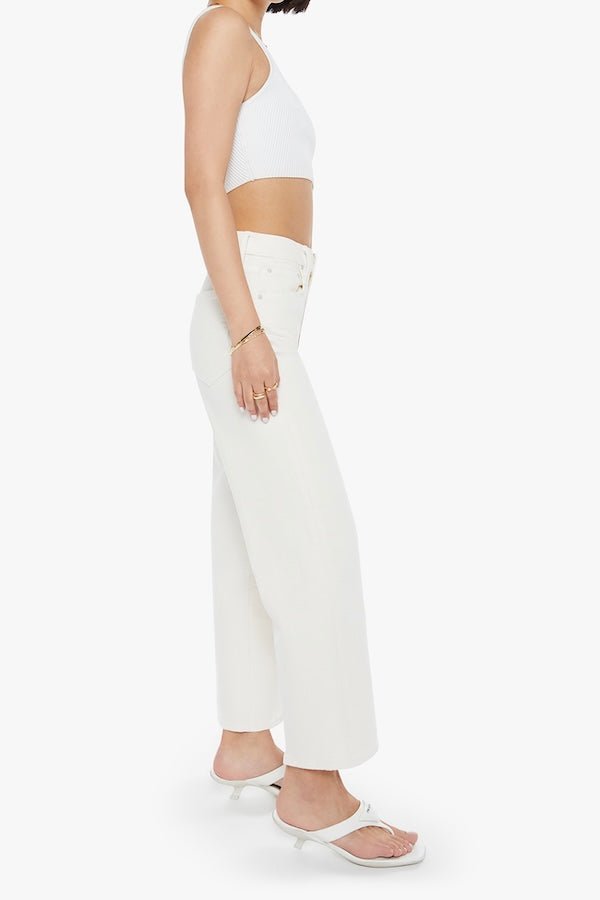 The Rambler Zip Ankle Cream Puffs by MOTHER, trendy high-waisted pants with a wide straight-leg design and ankle-length cut. Perfect for a relaxed, refined look with a soft off-white wash and tonal hardware.