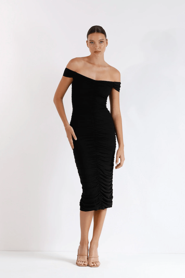 New Horizon Tapered Midi Black by Pasduchas – A trendy off-shoulder midi with ruched stretch mesh, sheer straps, and a flattering fitted silhouette. Perfect for elegant evenings and stylish occasions.