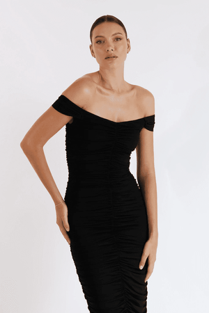 New Horizon Tapered Midi Black by Pasduchas – A trendy off-shoulder midi with ruched stretch mesh, sheer straps, and a flattering fitted silhouette. Perfect for elegant evenings and stylish occasions.