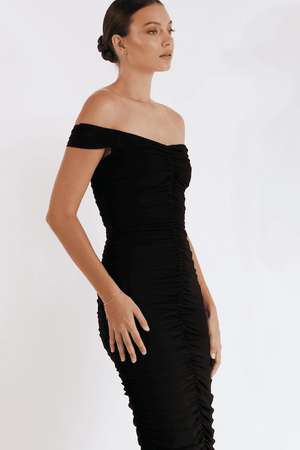New Horizon Tapered Midi Black by Pasduchas – A trendy off-shoulder midi with ruched stretch mesh, sheer straps, and a flattering fitted silhouette. Perfect for elegant evenings and stylish occasions.