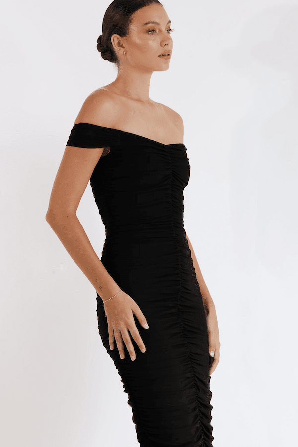 New Horizon Tapered Midi Black by Pasduchas – A trendy off-shoulder midi with ruched stretch mesh, sheer straps, and a flattering fitted silhouette. Perfect for elegant evenings and stylish occasions.