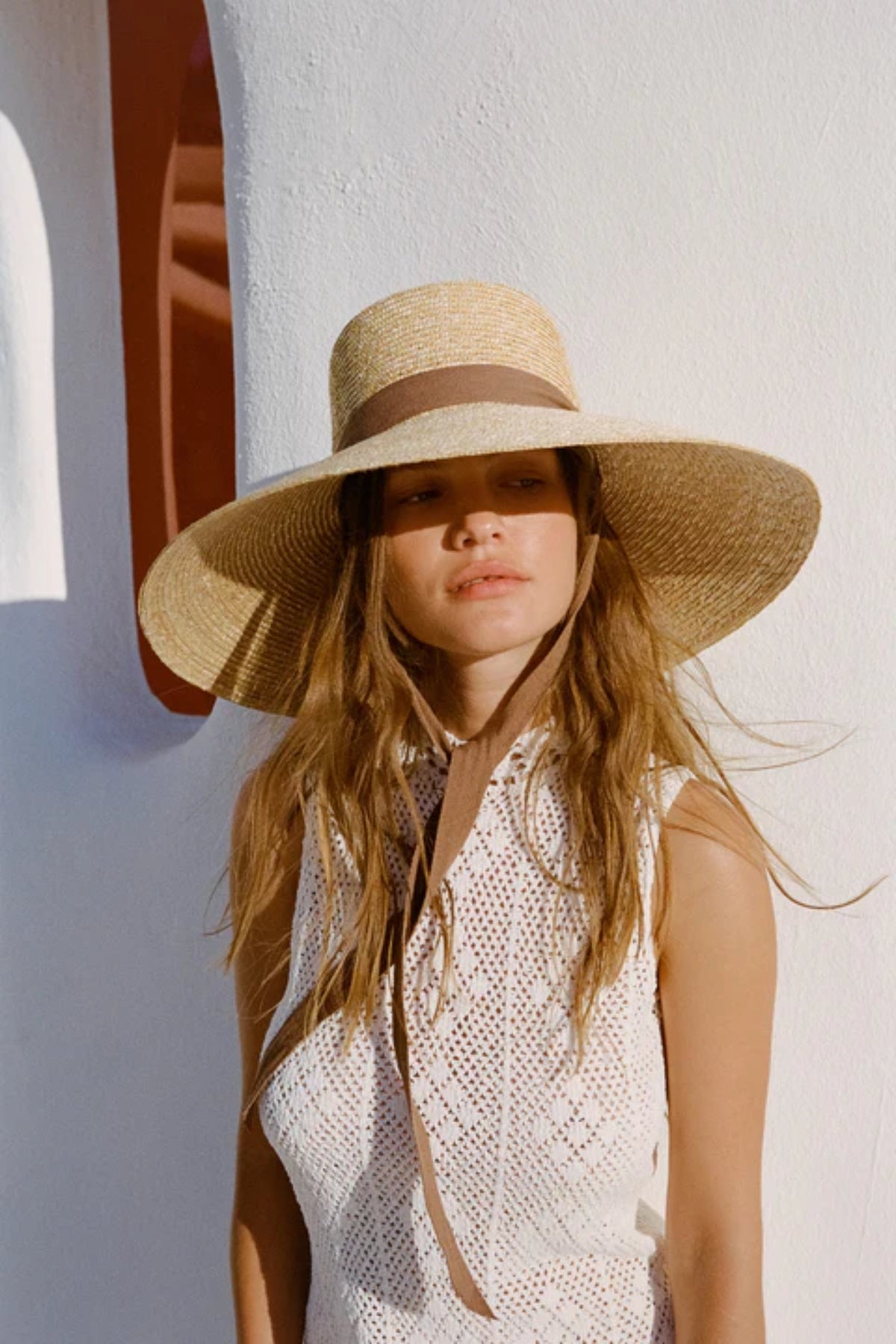Paloma Sun Hat Natural by Lack of Color, wide-brim wheat straw hat with detachable cotton tie and UPF 50+ protection for effortless summer elegance.