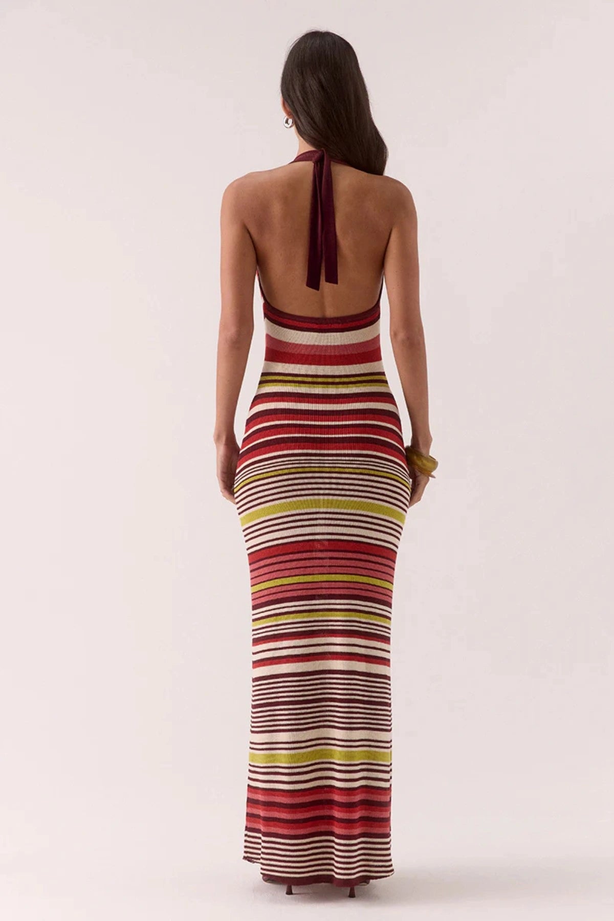 Pandora Knit Dress Stripe by Sovere – halter neck maxi with cowl neckline and fitted silhouette. Perfect for sunset dinners or nights out.