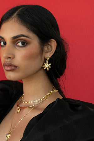 Pari Earrings Gold by Mountain and Moon – gold plated statement earrings with bold design. Perfect for elevated styling.