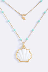 Party In Portofino Necklace Beach Glass White by Emma Pills – gold plated necklace with enamel beads and detachable shell pendant.