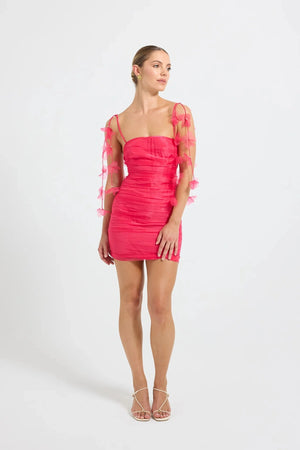 Pasduchas Cleo Mini Dress in soft-touch organza, featuring square neckline, removable petal strap details, fitted silhouette, and mini length.
