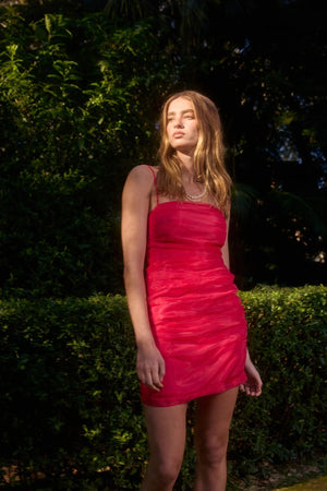 Pasduchas Cleo Mini Dress in soft-touch organza, featuring square neckline, removable petal strap details, fitted silhouette, and mini length.
