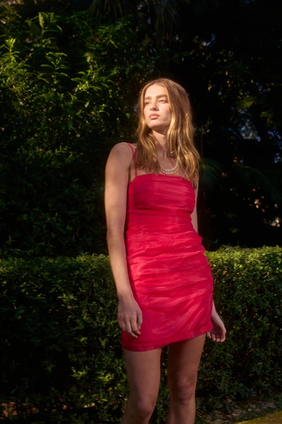 Pasduchas Cleo Mini Dress in soft-touch organza, featuring square neckline, removable petal strap details, fitted silhouette, and mini length.
