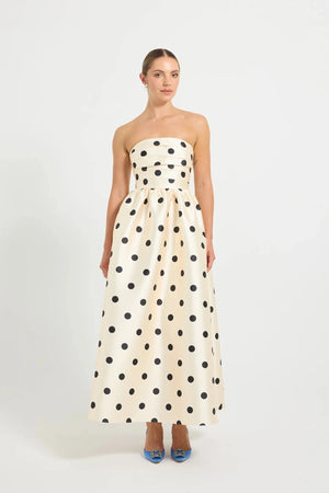 Pasduchas Dottie Strapless Midi in cream with black polka dots, strapless bodice with tucks, full flared midi skirt, and side pockets.