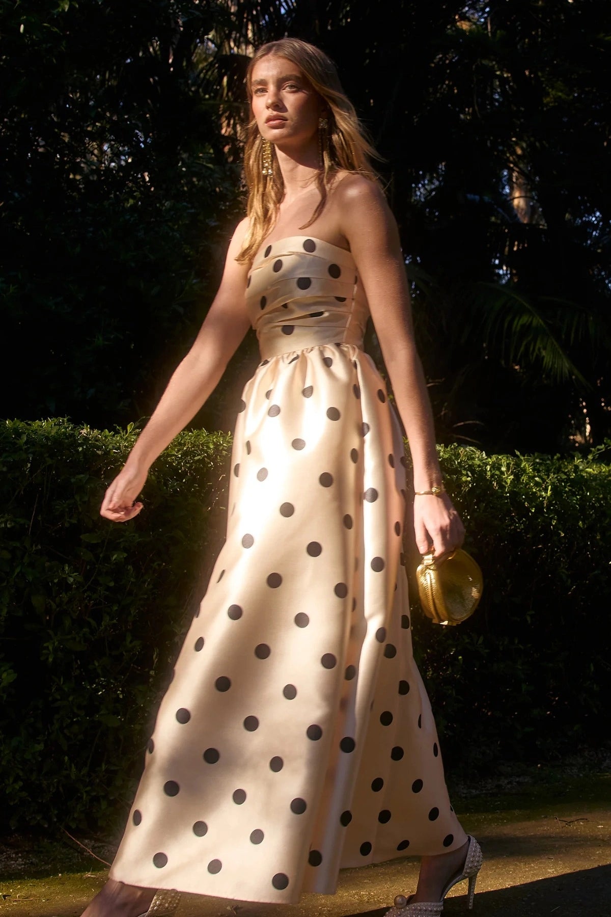 Pasduchas Dottie Strapless Midi in cream with black polka dots, strapless bodice with tucks, full flared midi skirt, and side pockets.
