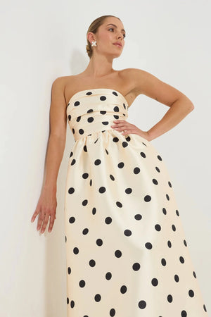 Pasduchas Dottie Strapless Midi in cream with black polka dots, strapless bodice with tucks, full flared midi skirt, and side pockets.