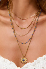 Peggy Necklace Blueberry by Arms of Eve, a dainty gold chain with blueberry enamel beads, perfect for summer layering and open-back looks.