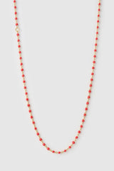 Peggy Necklace Cherry by Arms of Eve, a dainty gold chain with cherry enamel beads, perfect for summer layering and open-back looks.