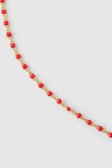 Peggy Necklace Cherry by Arms of Eve, a dainty gold chain with cherry enamel beads, perfect for summer layering and open-back looks.