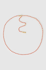 Peggy Necklace Cherry by Arms of Eve, a dainty gold chain with cherry enamel beads, perfect for summer layering and open-back looks.