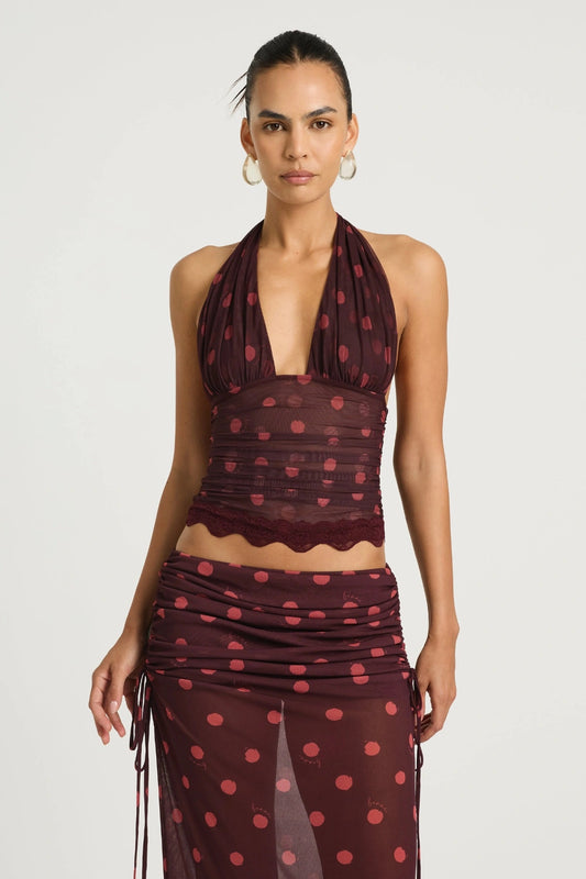 Penelope Top Plum Spot by Benni, a plunge halter lace-trim style with adjustable ties and stretch mesh lining for elevated day-to-night dressing.
