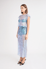 Delphine Skirt by Pfeiffer, relaxed midi length with mid-rise fit, sequin knit fabric. Ideal for layering over swimwear or briefs, 100% polyester. Spot clean only.
