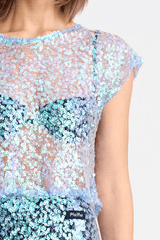 Delphine Skirt by Pfeiffer, relaxed midi length with mid-rise fit, sequin knit fabric. Ideal for layering over swimwear or briefs, 100% polyester. Spot clean only.