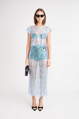 Delphine Skirt by Pfeiffer, relaxed midi length with mid-rise fit, sequin knit fabric. Ideal for layering over swimwear or briefs, 100% polyester. Spot clean only.