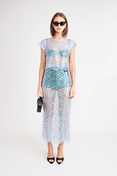 Delphine Skirt by Pfeiffer, relaxed midi length with mid-rise fit, sequin knit fabric. Ideal for layering over swimwear or briefs, 100% polyester. Spot clean only.