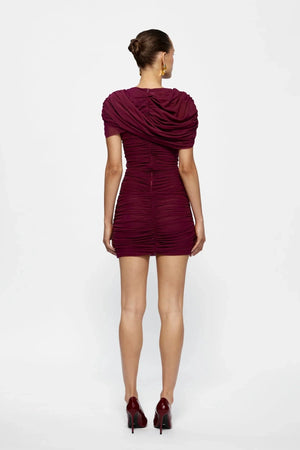 Phoenix Mini Burgundy by Effie Kats, soft mesh mini dress with ruching and draped shoulders, perfect for nights out or chic events.