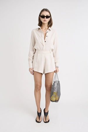 Pino Tailored Short by Pfeiffer — a lightweight mid-rise short with a curved hem and clean tailored finish, ideal for polished daytime looks.
