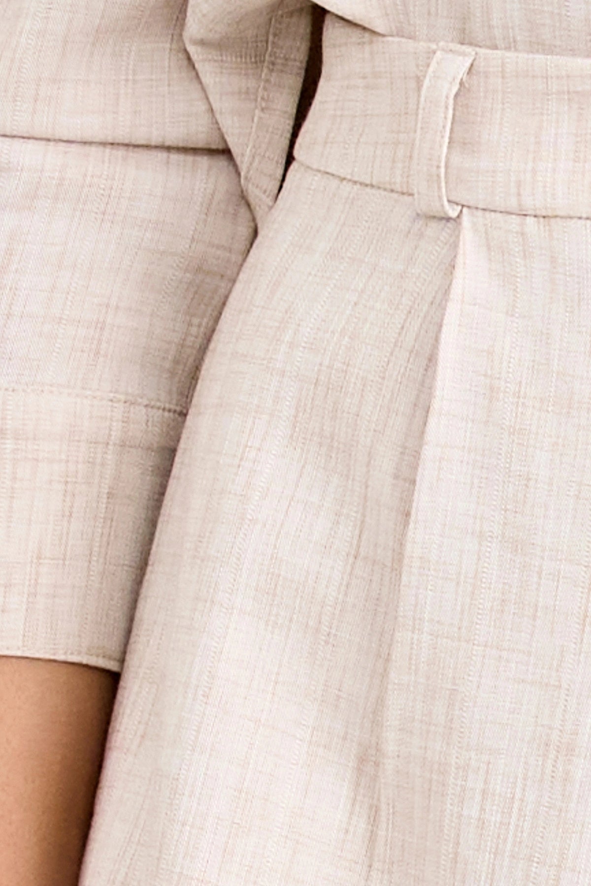 Pino Tailored Short by Pfeiffer — a lightweight mid-rise short with a curved hem and clean tailored finish, ideal for polished daytime looks.
