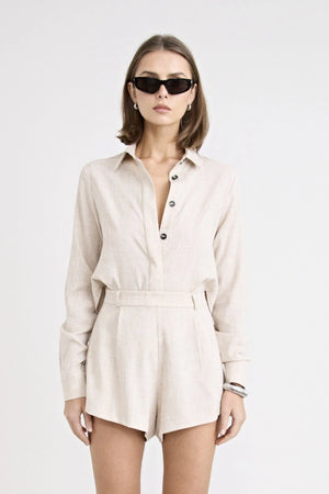 Pino Twist Shirt by Pfeiffer — a lightweight natural button-up with a subtle twist front and relaxed drape, perfect for effortless styling.
