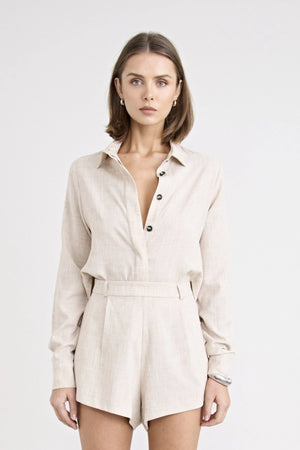 Pino Twist Shirt by Pfeiffer — a lightweight natural button-up with a subtle twist front and relaxed drape, perfect for effortless styling.
