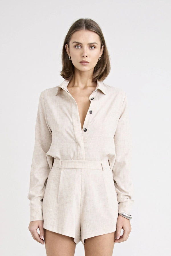 Pino Twist Shirt by Pfeiffer — a lightweight natural button-up with a subtle twist front and relaxed drape, perfect for effortless styling.
