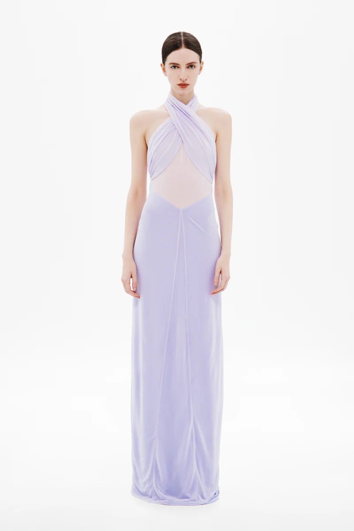 Pippa Braid Dress by Misha, a halter maxi in fluid jersey with crossover bodice, sheer midsection, and sculptural braided back for timeless elegance.
