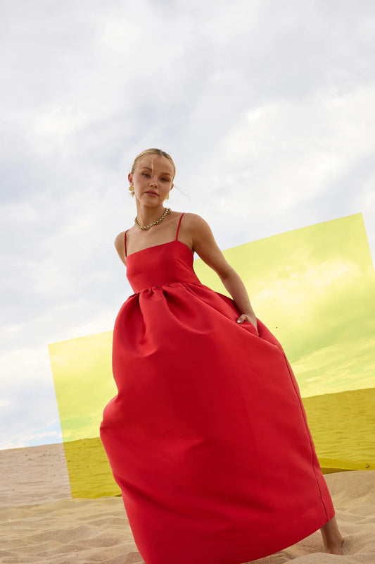 Pippa Flared Midi by Pasduchas — a poppy-red taffeta midi with adjustable straps and a full flowing skirt, perfect for elegant occasion wear.