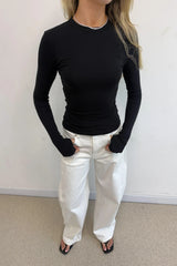 Polly Long Sleeve Top Black by Sneaky Link – a soft slim-fit top with round neckline and stretch. Perfect for everyday layering.