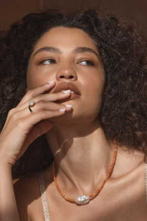 Pompeii Ring by Amber Sceats – handcrafted in Italy from 24K gold-plated brass, adorned with AAA+ freshwater pearls for timeless elegance.
