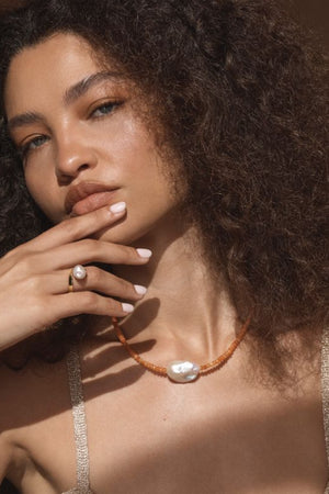 Pompeii Ring by Amber Sceats – handcrafted in Italy from 24K gold-plated brass, adorned with AAA+ freshwater pearls for timeless elegance.