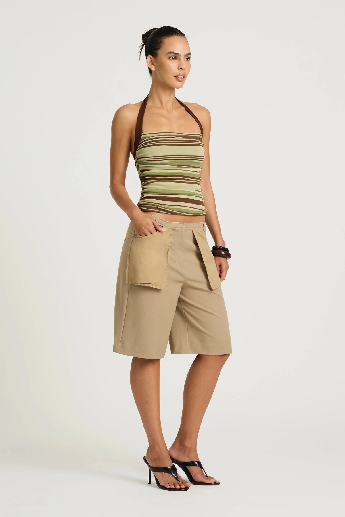 Poppy Halter Top Earth Stripe by Benni, a stretch halter top with ruching and a straight neckline for a sleek, flattering fit.
