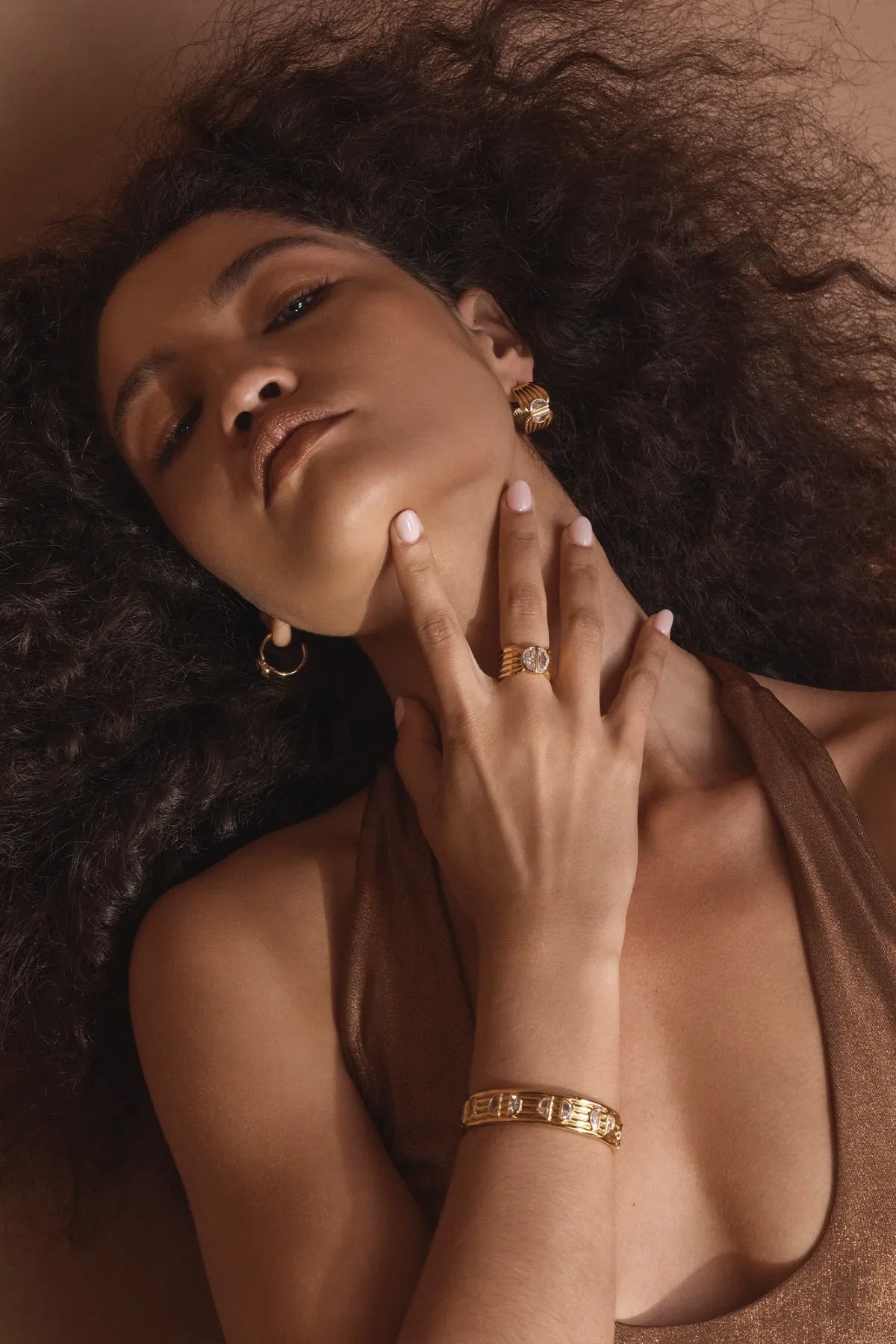 Positano Ring by Amber Sceats – handcrafted in Italy from 24K gold-plated brass, featuring a bold sculptural design with cubic zirconia detail.
