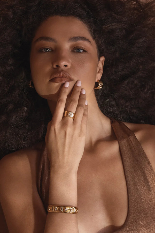 Positano Ring by Amber Sceats – handcrafted in Italy from 24K gold-plated brass, featuring a bold sculptural design with cubic zirconia detail.
