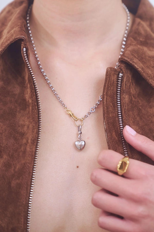 Puff Heart Necklace in Silver by Avant Studio, a silver belcher chain with detachable gold clasp and heart charm. Perfect layered or worn solo.