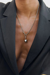 Puff Heart Necklace in Silver by Avant Studio, a silver belcher chain with detachable gold clasp and heart charm. Perfect layered or worn solo.