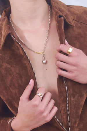 Puff Heart Necklace in Silver by Avant Studio, a silver belcher chain with detachable gold clasp and heart charm. Perfect layered or worn solo.