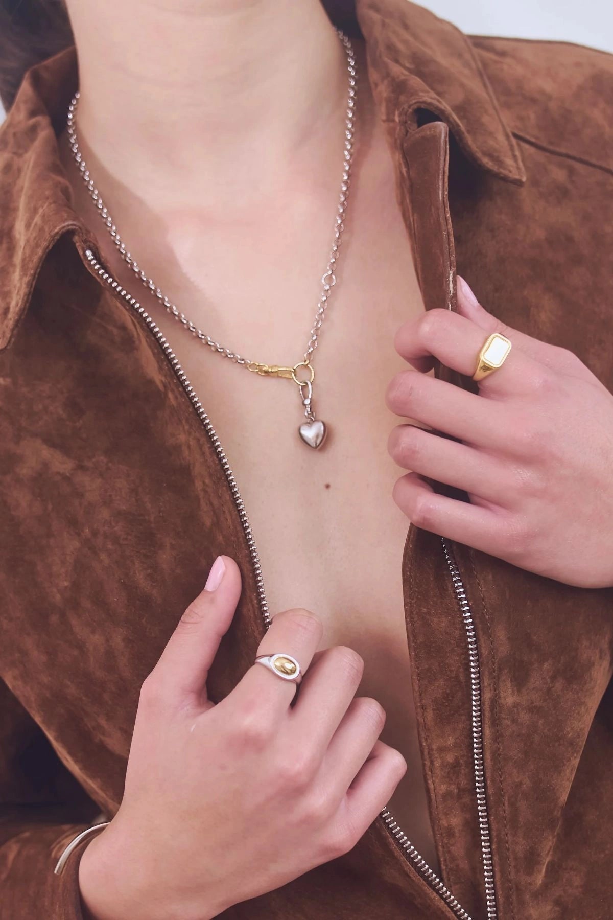 Puff Heart Necklace in Silver by Avant Studio, a silver belcher chain with detachable gold clasp and heart charm. Perfect layered or worn solo.