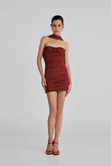 Quimera Mini Dress Chestnut by Maygel Coronel – a ruched mini with floral detail and open back. Perfect for statement styling.